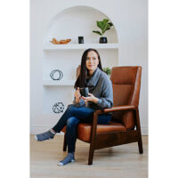 woman drinking coffee in a custom brown leather recliner