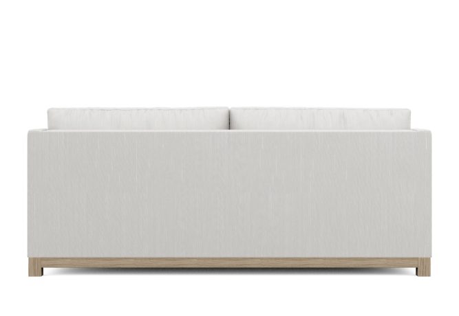 back view of white modern condo sofa with wood base