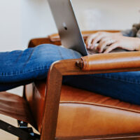 wood arm detail on a custom brown leather recliner