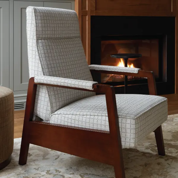 custom oxford recliner in front of a fireplace by vogel