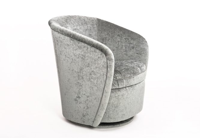 An angled side view of a sleek swivel chair with rounded arms in silver velvet fabric