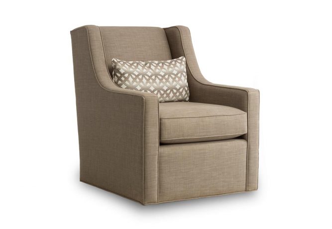 brown swivel chair with fancy back pillow