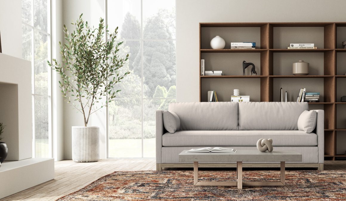 scandinavian style sofa with wood base and a cream fabric