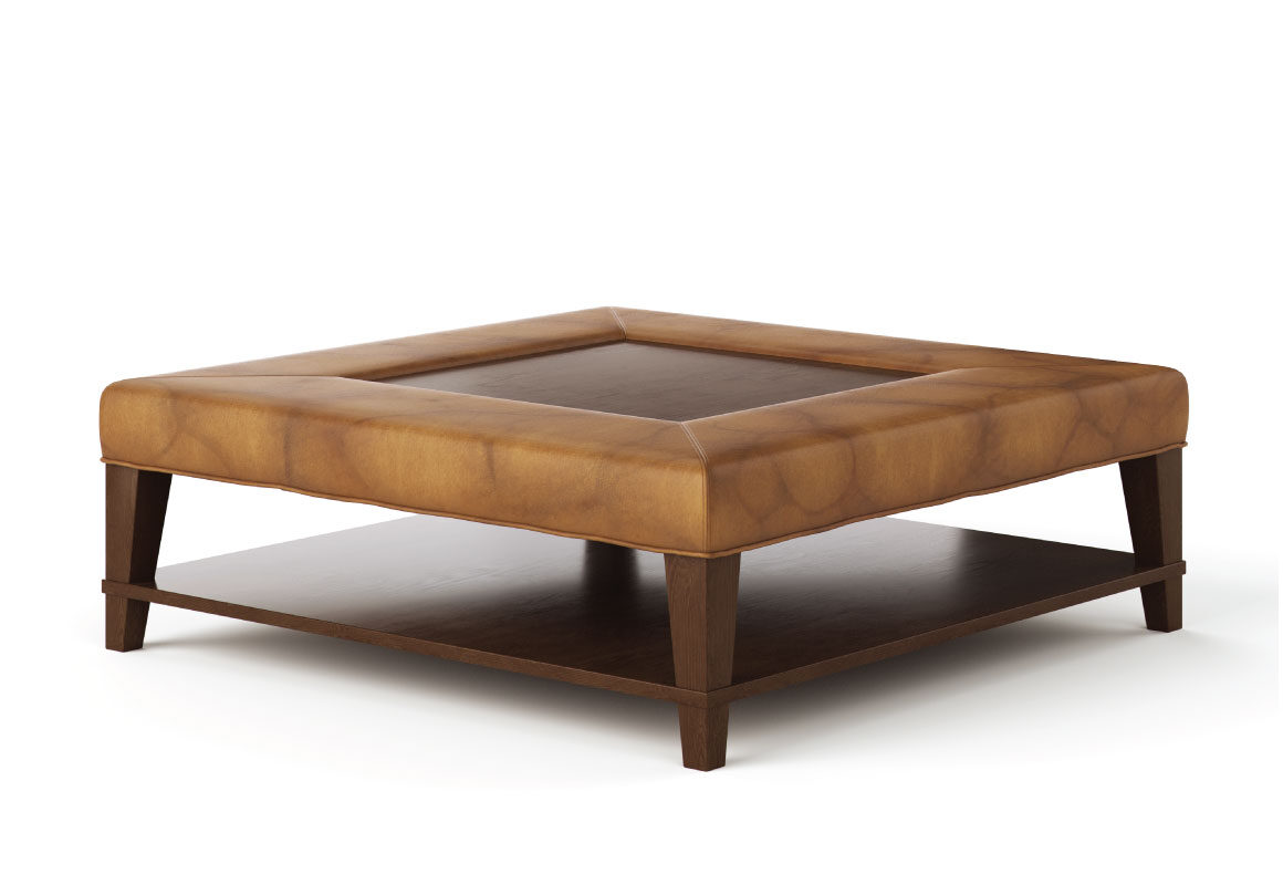 Angled shot of the traditional-style Kingston Ottoman made by Vogel in light brown leather with a wooden shelf and wood accents