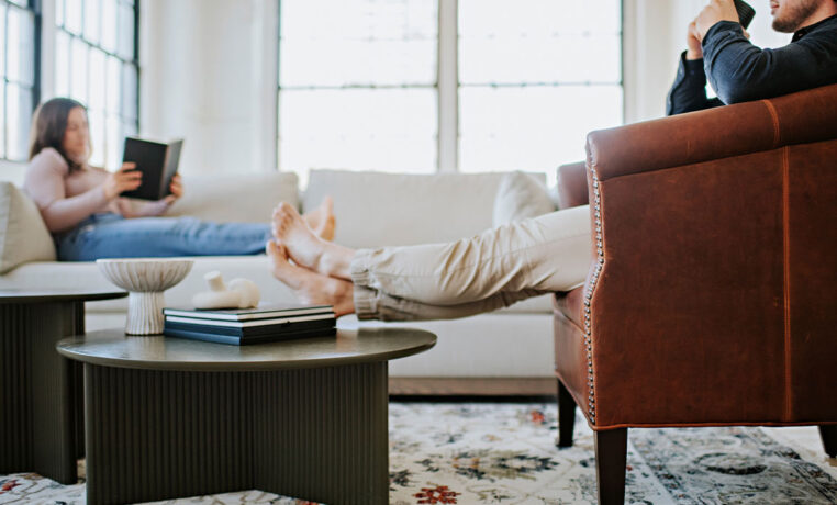 detail shot of a custom lounge chair with man sitting in it with his feet up