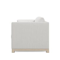 side view of white modern loveseat with oak wood base