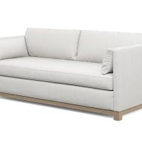 whtie modern condo sofa with grey oak wood stained base side view