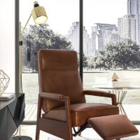 The Oxford leather reclining chair by Vogel styled against bright window.