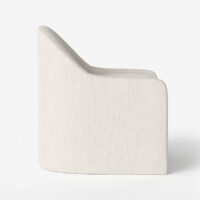 Side view of curved silhouette of the Amelia upholstered dining chair by Vogel. Made in Toronto, Ontario.