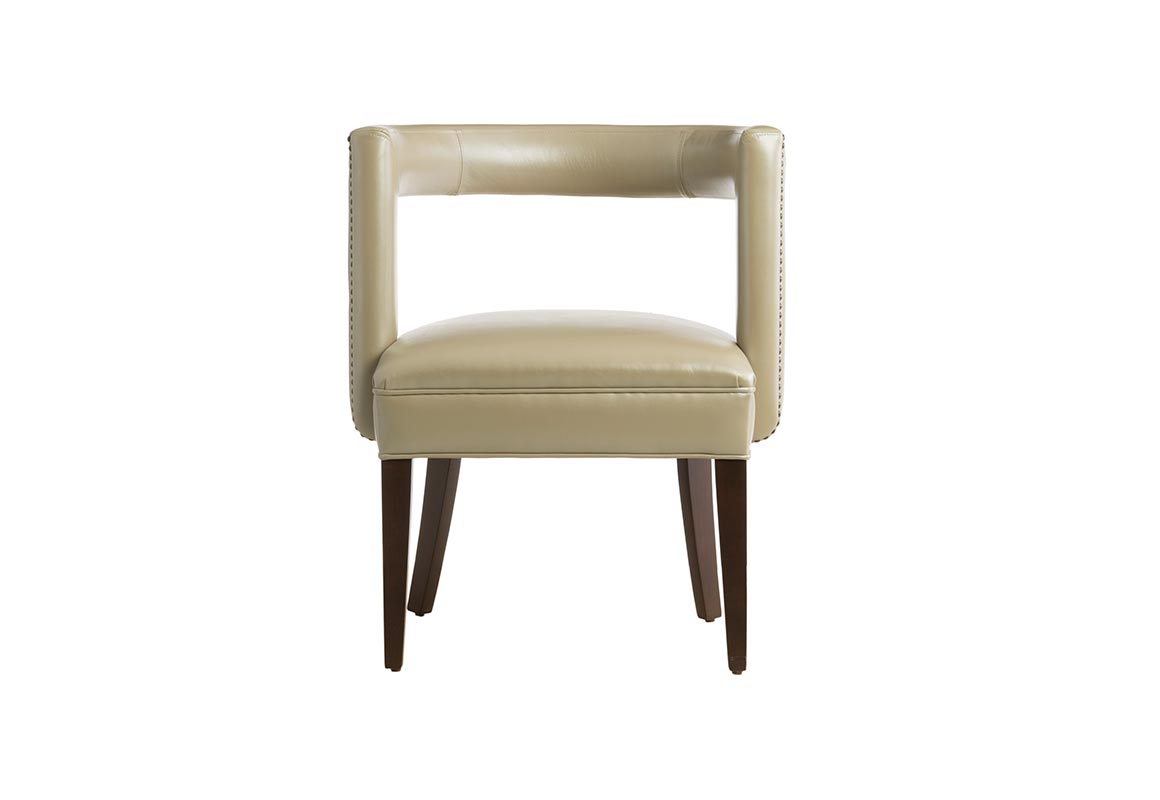 Beautiful contemporary accent chair featuring beige leather with nail head trims on the back and an espresso wood finish on the flared legs.