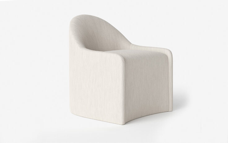 Angle view of the Amelia upholstered dining chair by Vogel. Made in Toronto, Ontario.