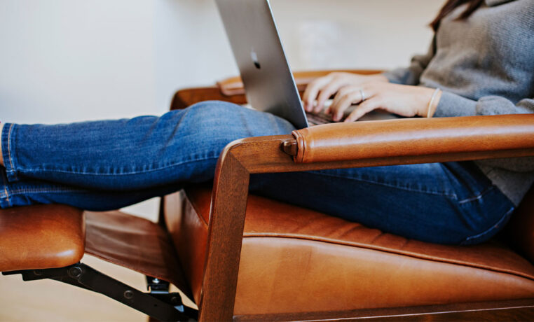 wood arm detail on a custom brown leather recliner