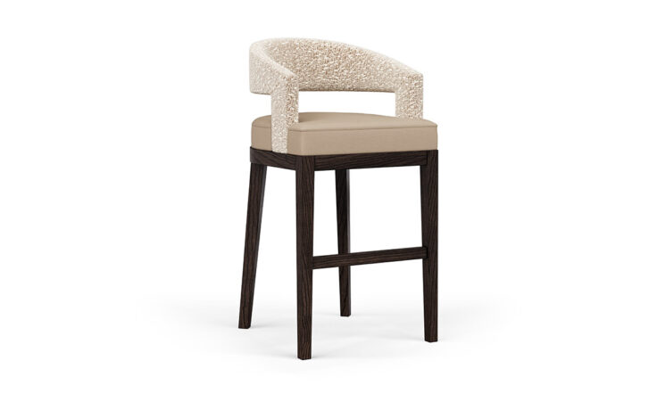 The Zayn bar stool with a fabric seat and wooden legs.