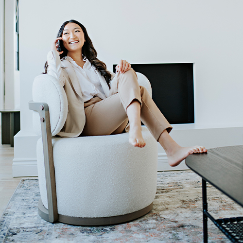 woman talking on the phone in a swivel chair