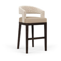 The Zayn bar stool with a fabric seat and wooden legs.