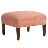 Angled shot of classic Stirling Ottoman by Vogel with red fabric and brown wood finish