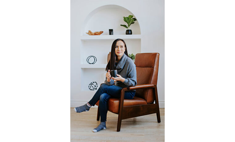 woman drinking coffee in a custom brown leather recliner