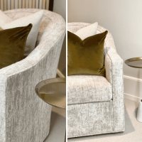 Shiny and luxury white velvet Pierre swivel tub chairs with glamorous throw pillows.