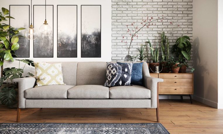 Bright modern room with beige mid century modern sofa as focal point